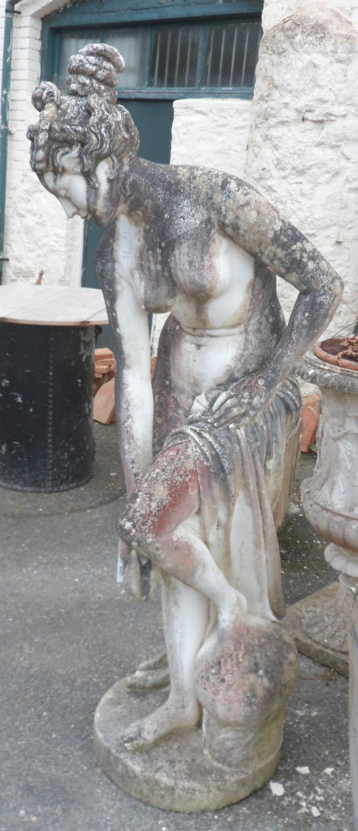 A 5' 4" pre cast life size Neoclassical style garden statue of Venus 'The Bather', after