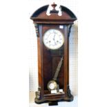 An early 20th Century stained walnut and mixed wood cased regulator style wall clock with