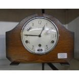 A mid 20th Century Bentima polished oak cased mantel clock with eight day chiming movement