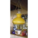 An oil lamp style pendant light fitting