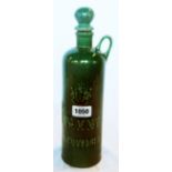 A green ceramic Rives Gin bottle