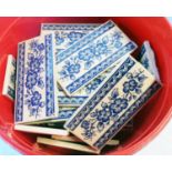 A quantity of blue and white floral decorated tiles - used