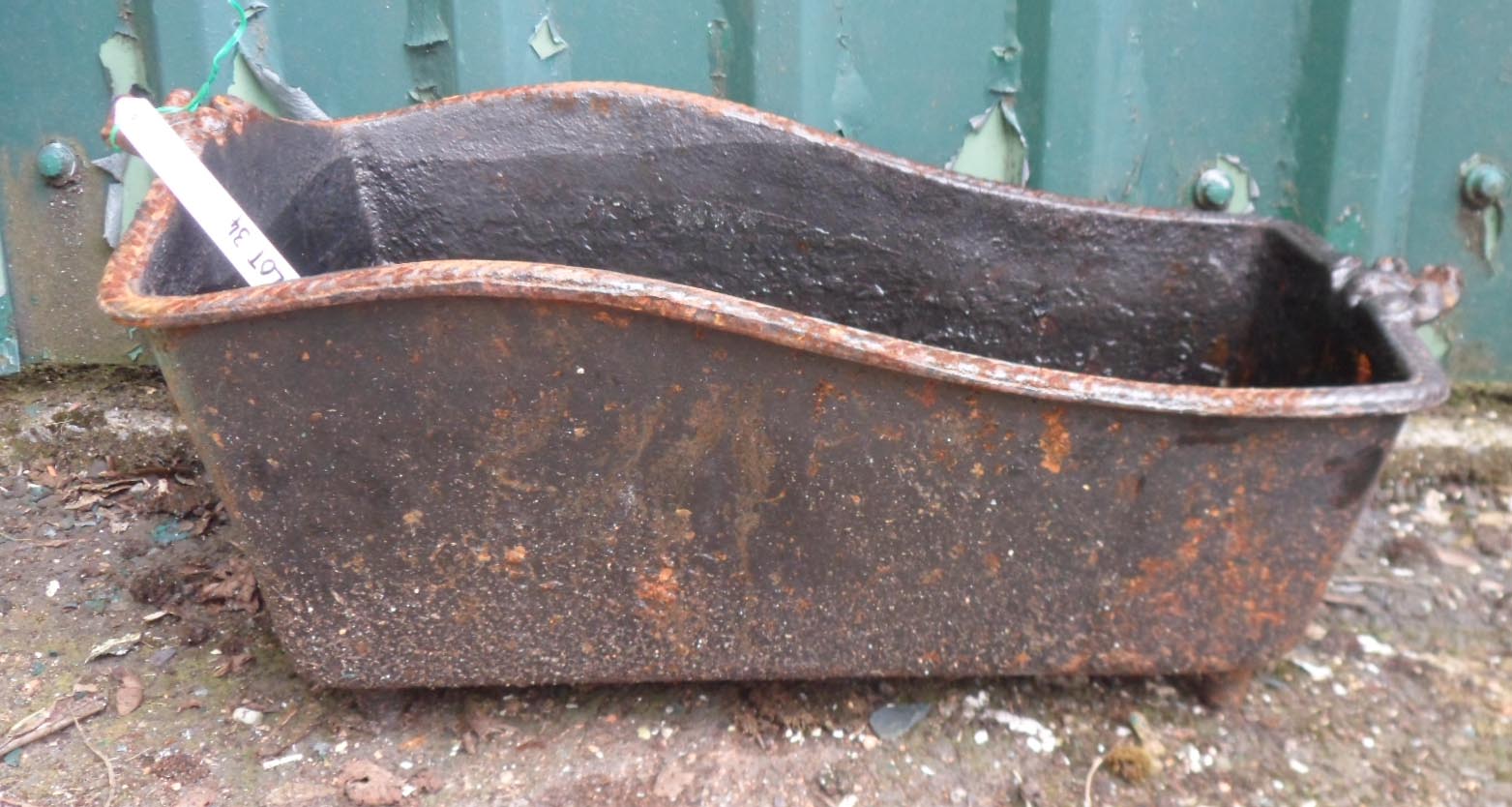 A small decorative cast iron trough