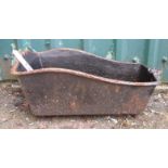 A small decorative cast iron trough