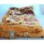 A vintage French Rococo-style chenille bedspread with floral and putti decoration and fringed ends