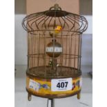 A cloisonné style reproduction automaton birds in cage alarm clock