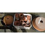 A collection of old terracotta flower pots