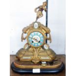 A mid 19th Century French ornate gilt brass cased salon mantel clock with figure of a faun to top (