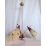 A 1950's three branch centre light fitting with printed opaque glass shades