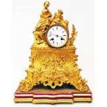 A mid 19th Century gilt metal cased figural mantel clock with country girl seated beside and