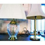 A modern table lamp with bulbous glass base and a modern brass column pattern table lamp - both with