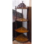 An inlaid walnut and mixed wood four shelf corner whatnot with fretwork to top, decorative turned