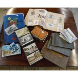 A postcard album containing cards from Cornwall, a scrap album, three photograph albums, another