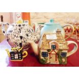 Three teapots, comprising Cardew 101 Dalmatians, cottage pattern and another - sold with a range