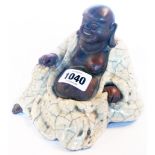 A ceramic figure of Hotei with crackle glaze