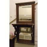 An Edwardian walnut framed wall mirror with two bevelled plates and bracketed shelf