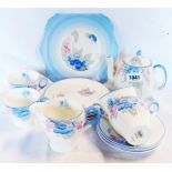A Shelley floral pattern part tea set including teapot and milk jug