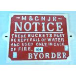 A reproduction Midland & Great Northern Joint Railway cast iron fire buckets sign - later painted