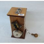 An old portable call bell with long extension wire