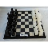 An onyx chess set and board