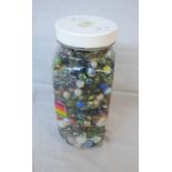 A jar containing a collection of marbles