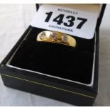 An marked 18c three stone gypsy set diamond ring