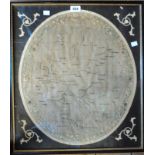 A Georgian framed oval sampler depicting a map of Europe by Ann Saunders and dated 1810, in