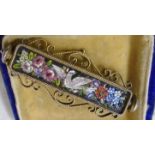 An Italian Grand Tour bar brooch with central micro mosaic dove and flanking floral decoration