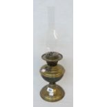 A brass table oil lamp with chimney