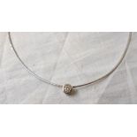 An Italian 18ct. white gold wire choker necklace with diamond solitaire disc