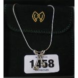 An Italian 18ct. white gold pendant necklace, set with cinnamon and green diamonds - with box and