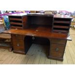 A 4' 7" early 19th Century mahogany twin pedestal estate desk with part lift-top and fall-front