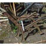 A pair of cast metal child's bench ends