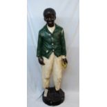 A 4' 11" 1930's painted plaster figure of a black man on plinth base