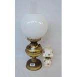 A Duplex brass table oil lamp with original chimney and globe - sold with a miniature ceramic oil