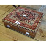 An 11 1/2" Victorian rosewood and strung footstool with tapestry panel to lid enclosing a tin hot