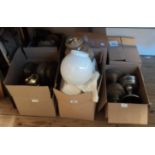 A large quantity of assorted table oil lamps and glass shades