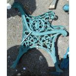 A pair of cast metal bench ends