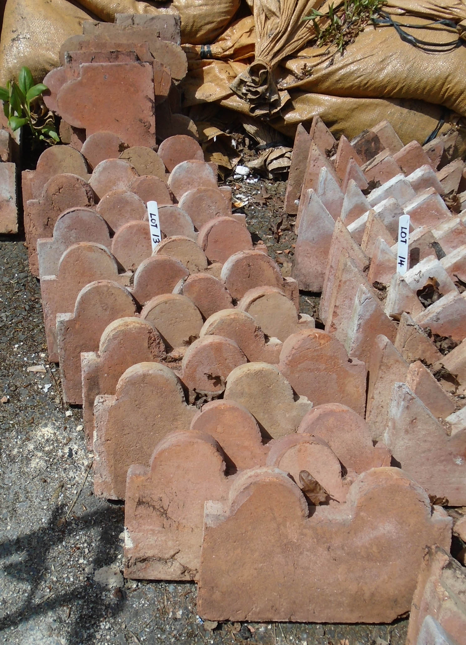 Thirty terracotta twin dome top edging tiles