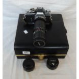 A cased Minolta XE-1 camera body, Vivitar 75-205mm telephoto lens, Minolta 28mm and 50mm lenses,