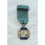 An enamelled silver Long Service medal for The National Operatic and Dramatic Association,