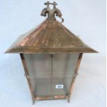 A large copper hall lantern with oblique glass panes