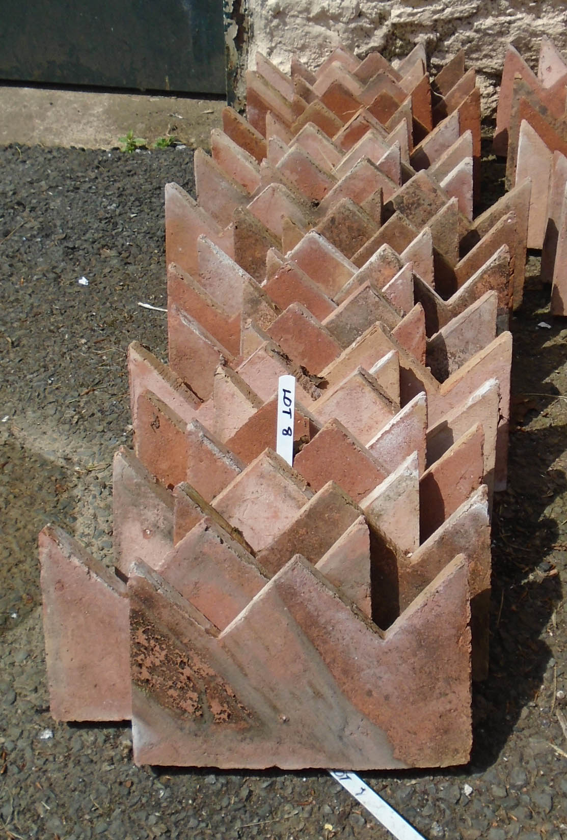 Thirty terracotta crown top edging tiles