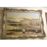 An ornate framed reproduction oil on canvas, depicting a 19th Century beach scene with figures