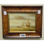 A burr maple framed oil on panel, depicting sailing vessels and small rowing boat with figures on