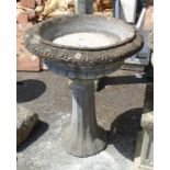 A 23" diameter precast Classical style urn pattern planter, on an associated base