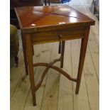 A 19 1/2" early 20th Century mahogany envelope card table with swivel pop-up action and single