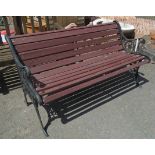 A 4' 2" slatted garden bench with cast iron ends
