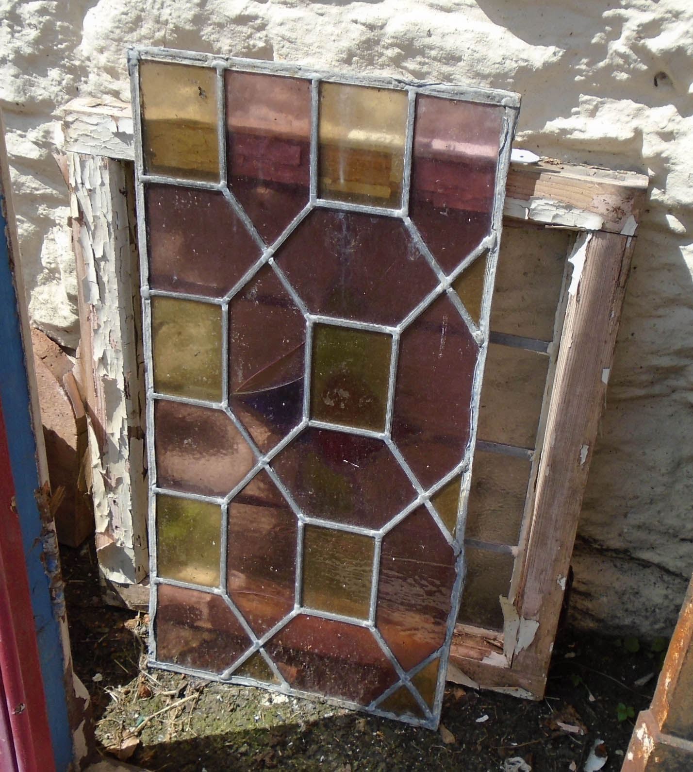 A pine framed window light with oblique glass and coloured decoration - sold with a decorative