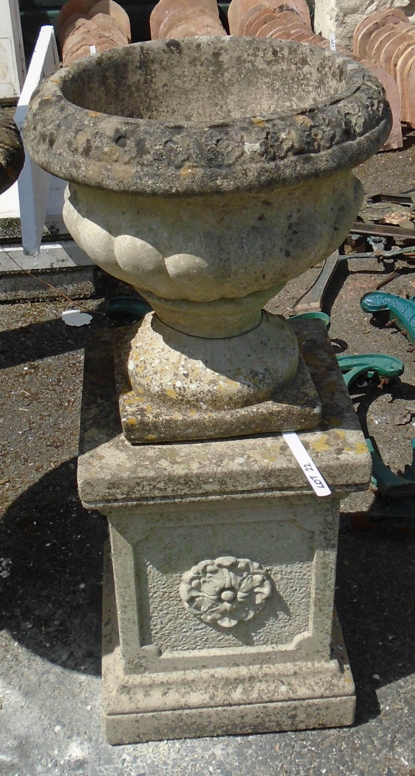 A precast garden urn on faceted pedestal base - 2' 6" high overall